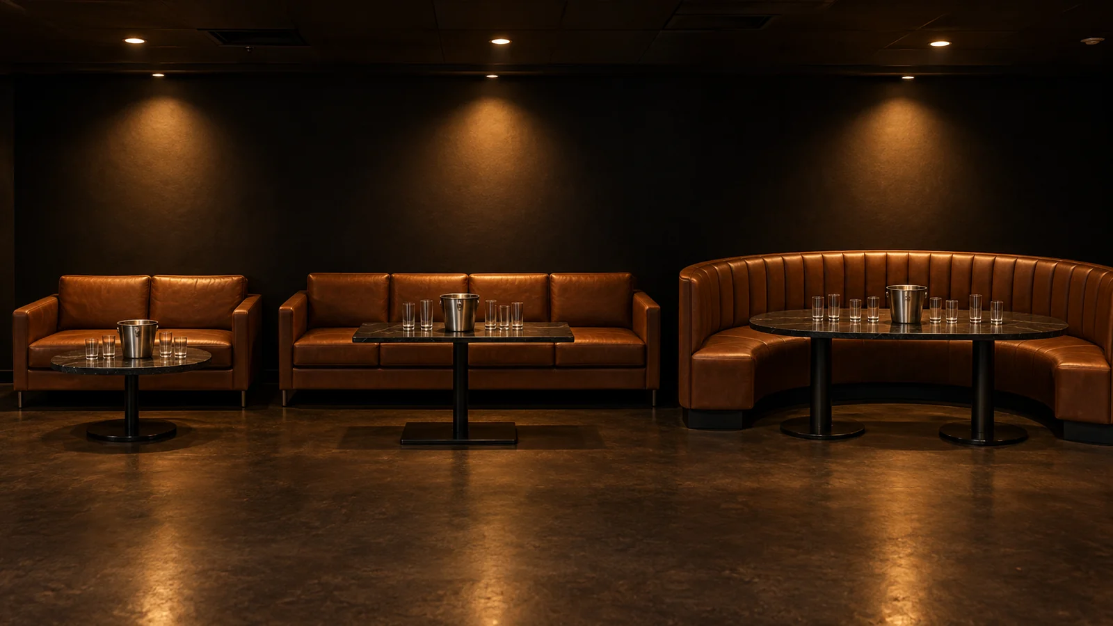 Three long sofas arranged around low tables before a group arrives