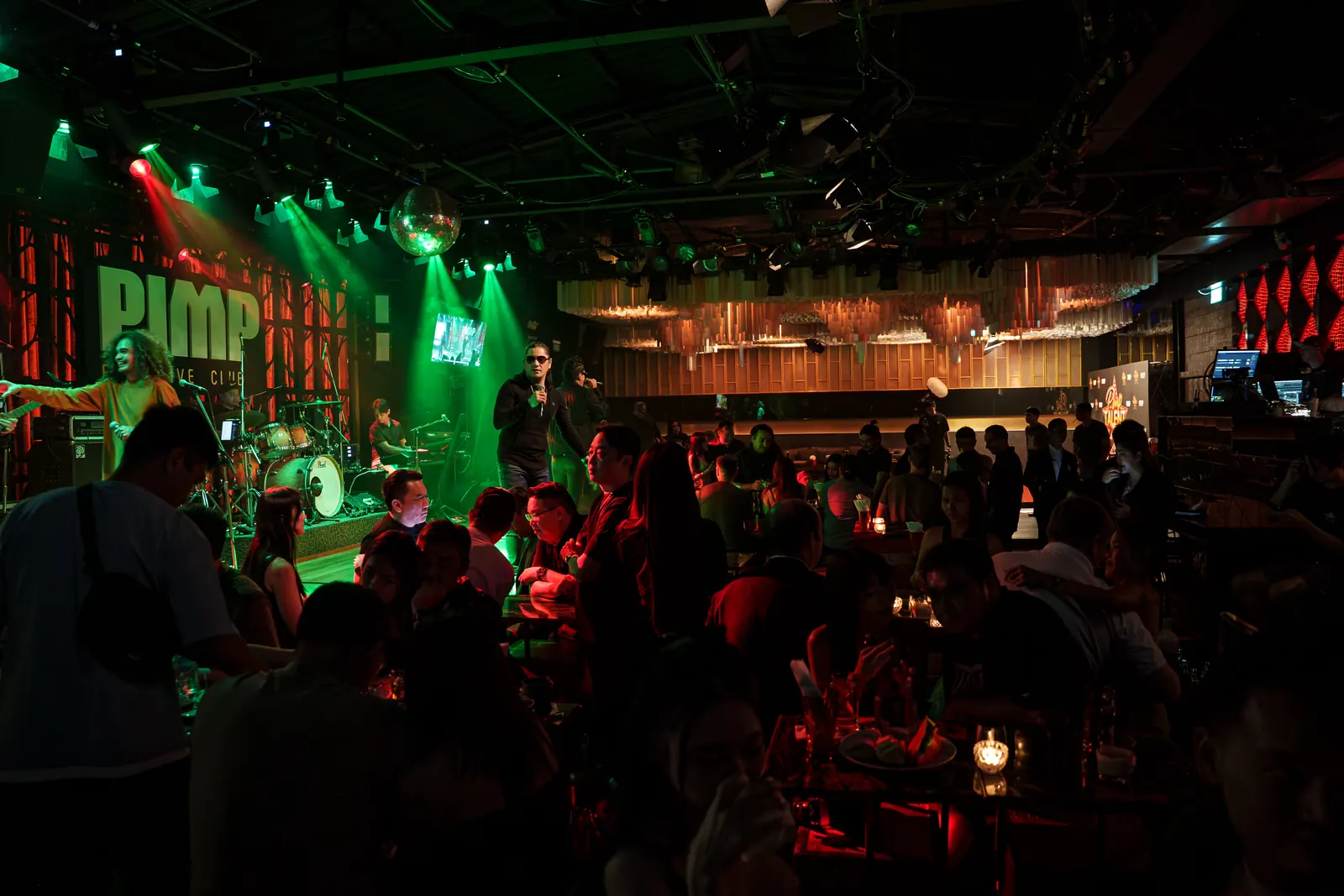 The club floor at full tables while the band plays
