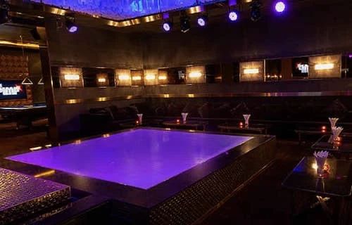 A party room with its own dance floor and stage lighting