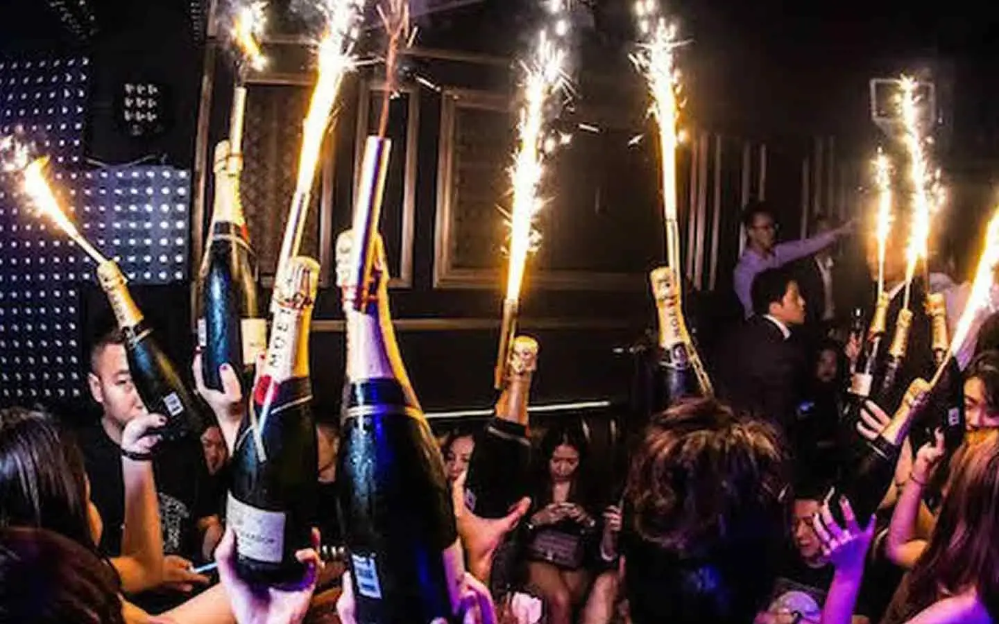 Champagne open in the group’s own VIP section after dark